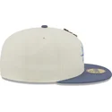 graue-und-blaue-anliegende-flat-cap-59fifty-the-elements-air-pin-der-seattle-mariners-mlb-von-new-era