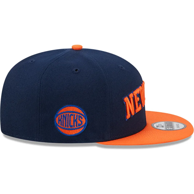 marineblaue-und-orangefarbene-flache-snapback-kappe-9fifty-statement-der-new-york-knicks-nba-von-new-era