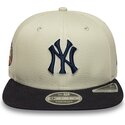 beige-snapback-flatcap-mit-marineblauen-logo-9fifty-original-fit-world-series-der-new-york-yankees-mlb-von-new-era